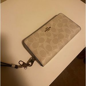 Tan Coach wristlet, almost new.